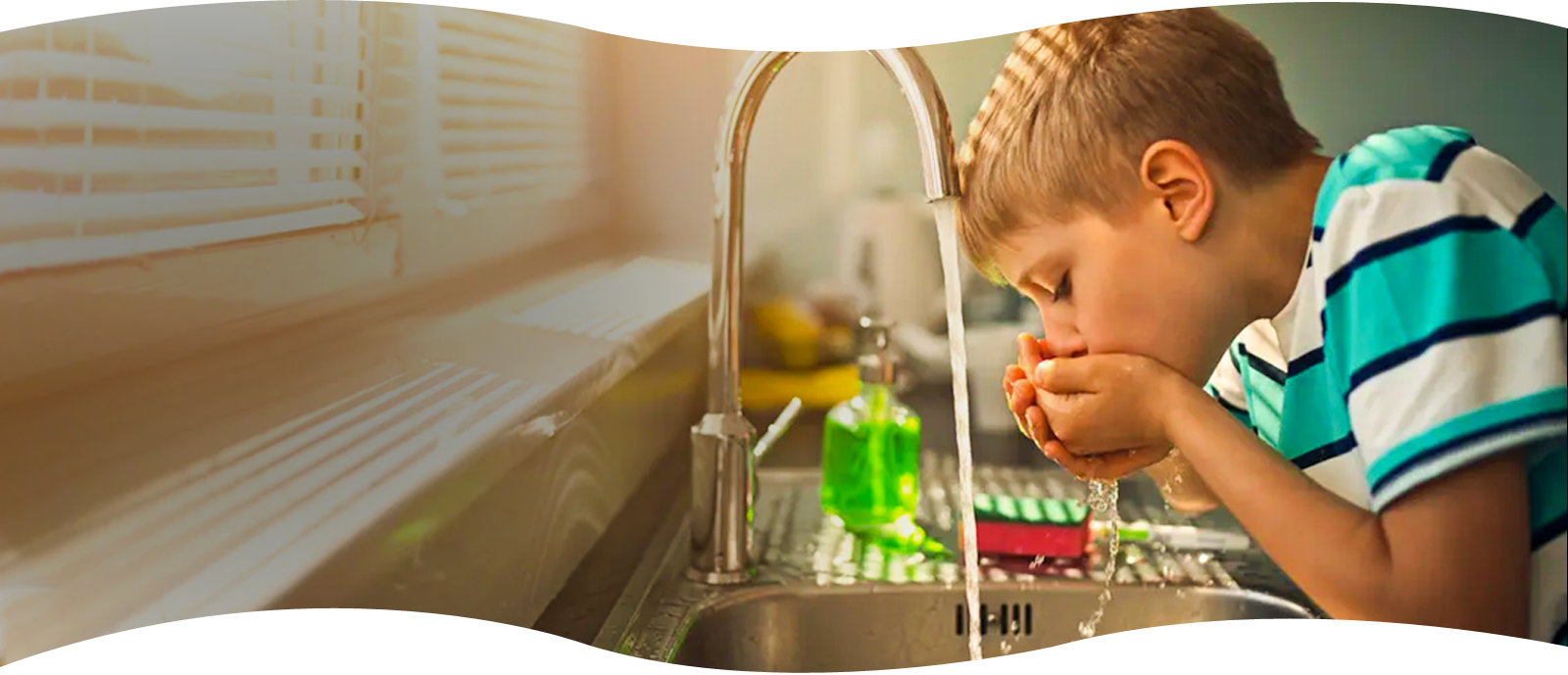 boy drinking water with chlorine in it to show the importance of chlorine-removal