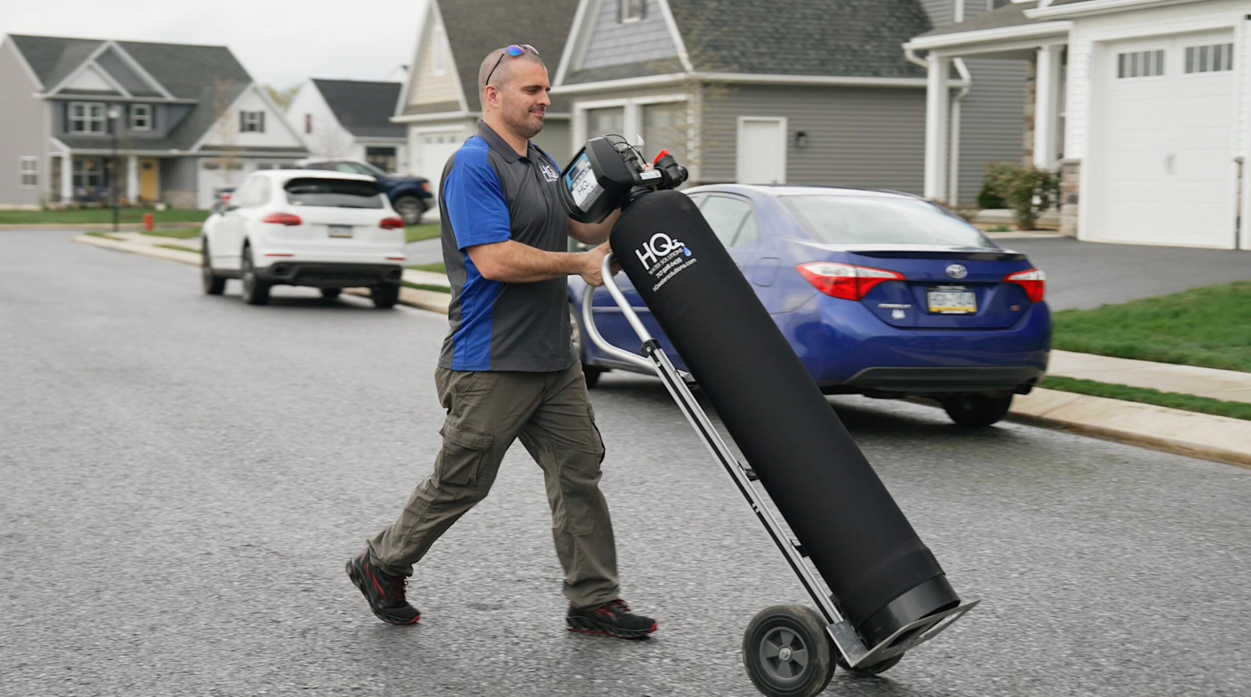 Employee installing a Water Softener System